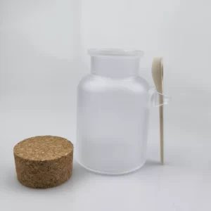 Frasco de vidrio esmerilado con tapa de corcho y cuchara de madera