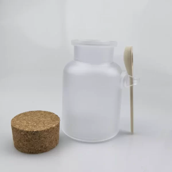 Frasco de vidrio esmerilado con tapa de corcho y cuchara de madera