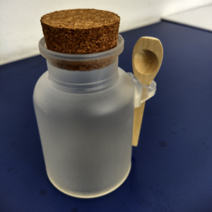Frasco con cuchara de madera